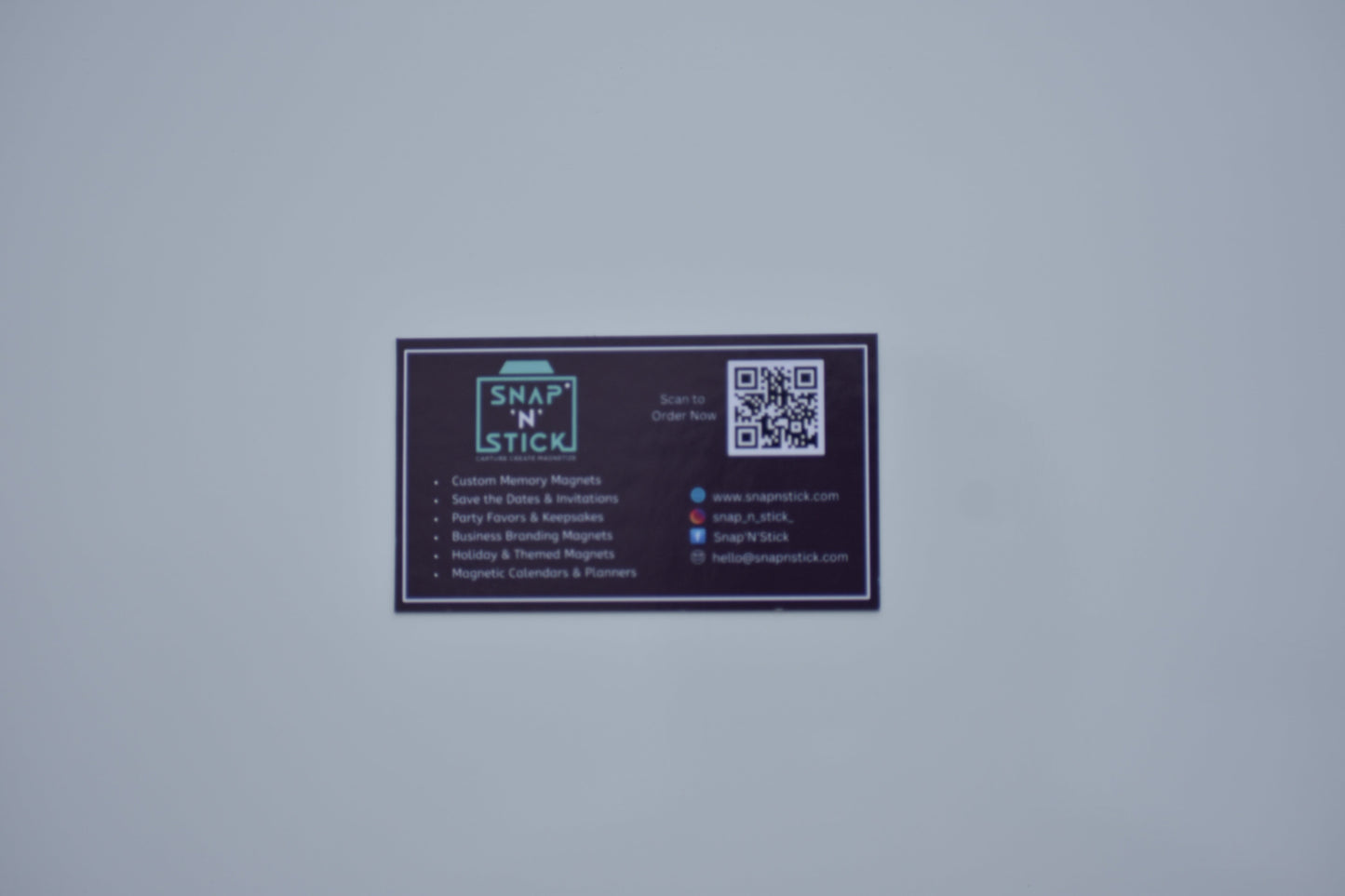 Custom magnetic business cards on a metal surface by Snap'N'Stick