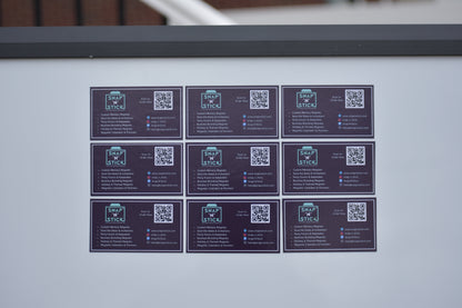 Nine custom magnetic business cards displayed on a metal surface — bulk magnetic business card order by Snap'N'Stick